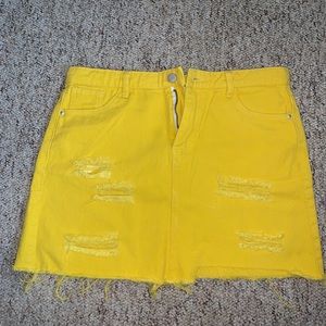 Distressed yellow denim skirt